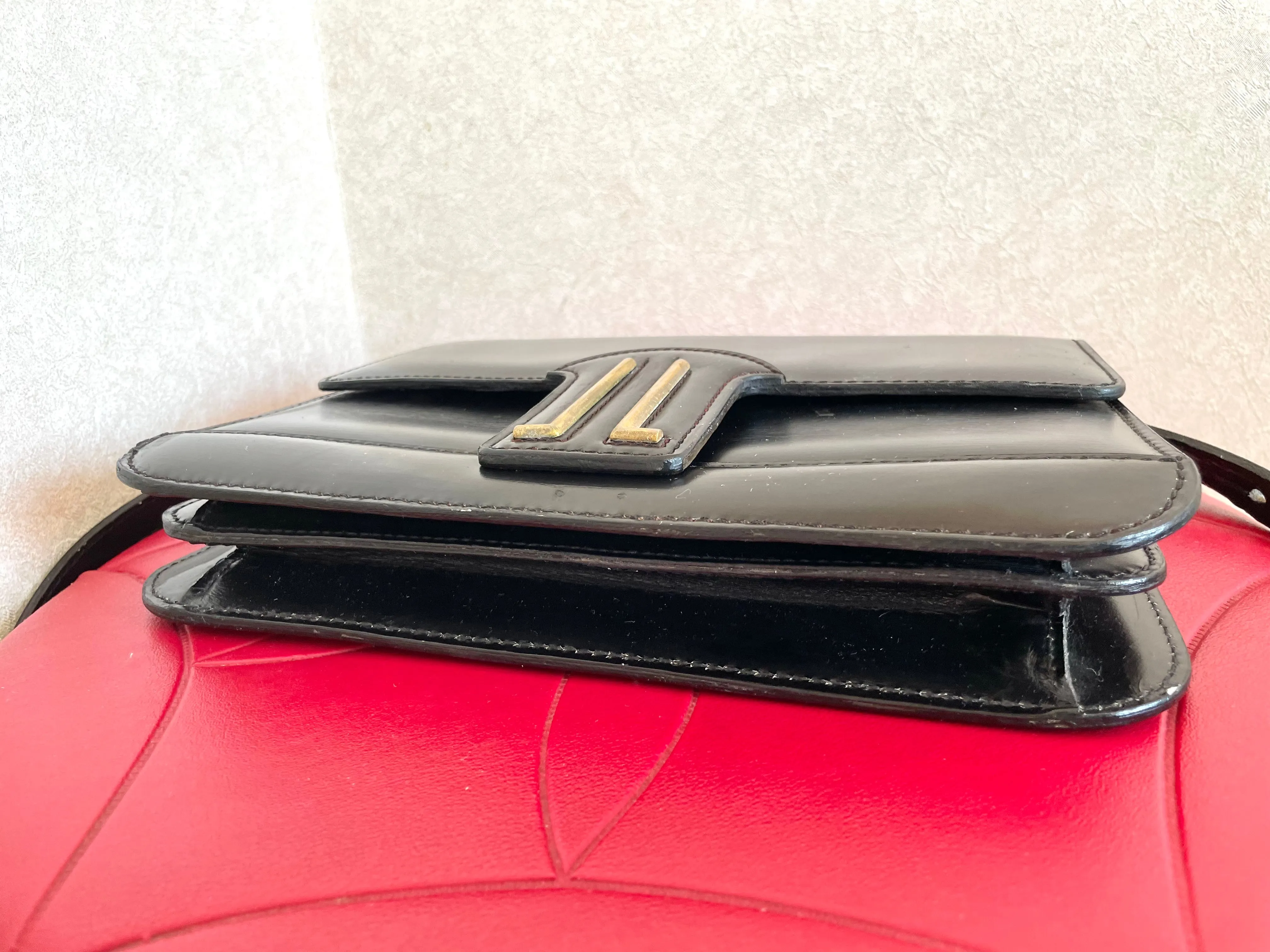 Vintage Lanvin black leather shoulder bag with iconic golden logo motif, Classic purse for daily use. 050222ya1