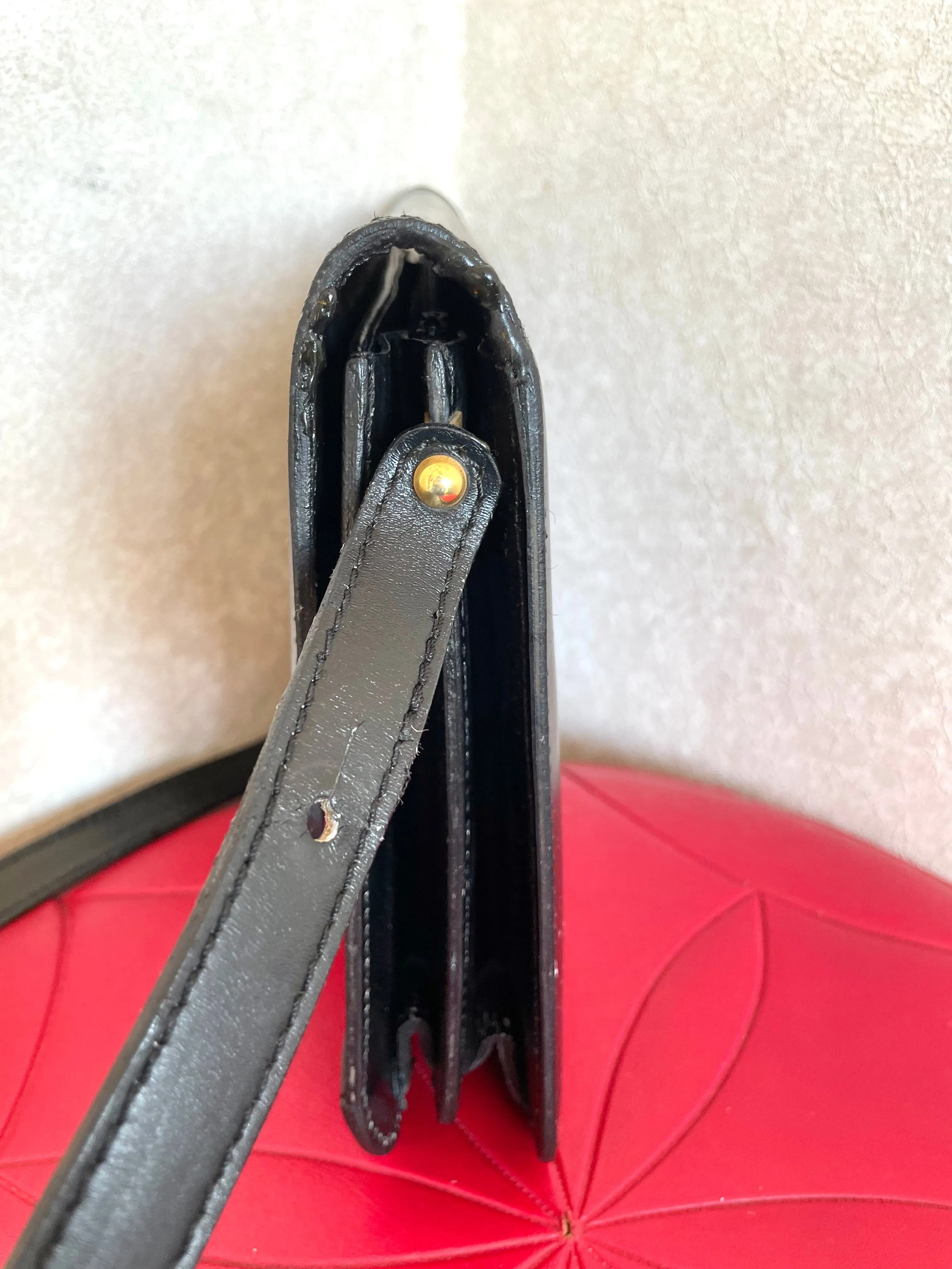 Vintage Lanvin black leather shoulder bag with iconic golden logo motif, Classic purse for daily use. 050222ya1