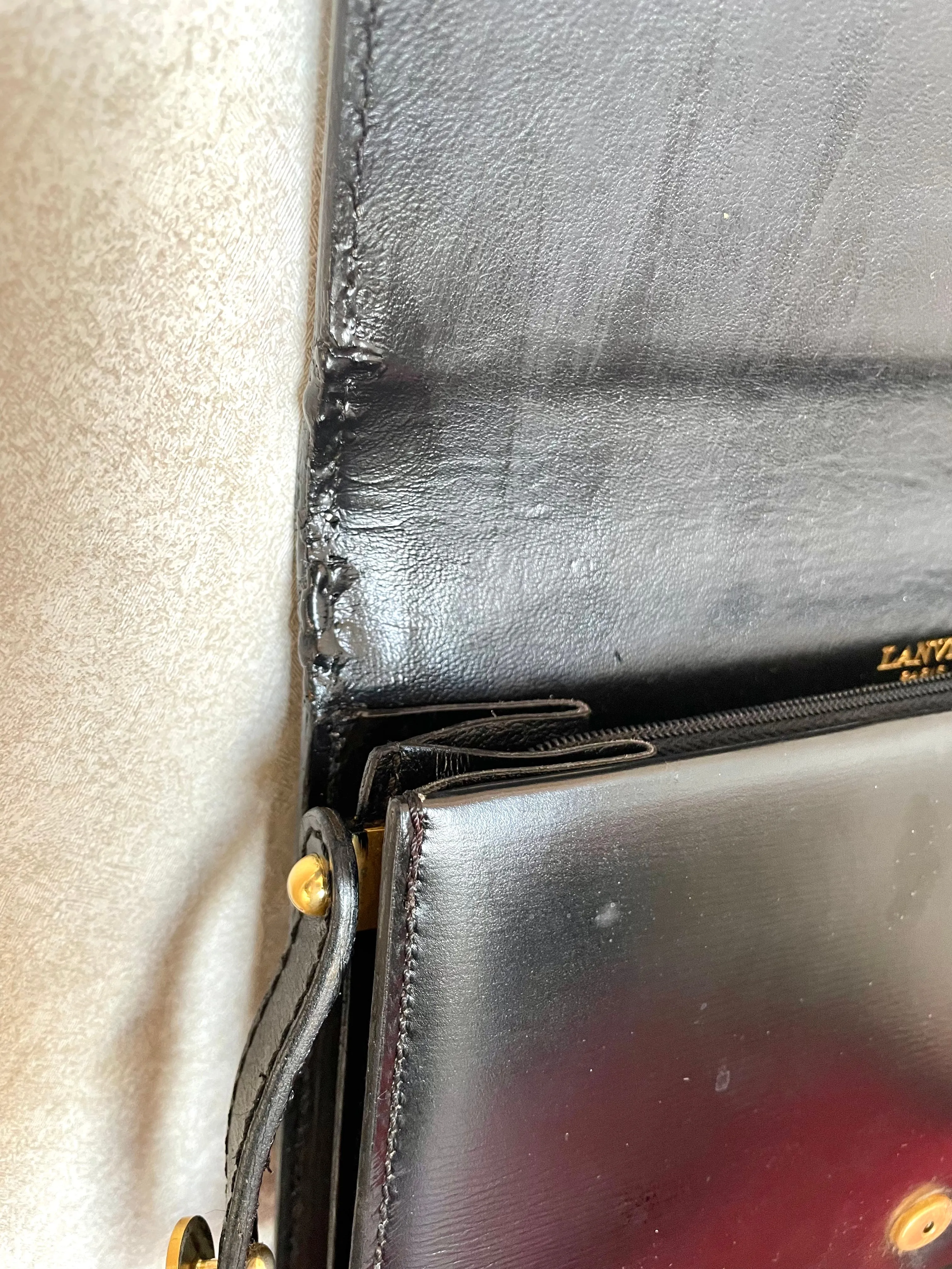 Vintage Lanvin black leather shoulder bag with iconic golden logo motif, Classic purse for daily use. 050222ya1