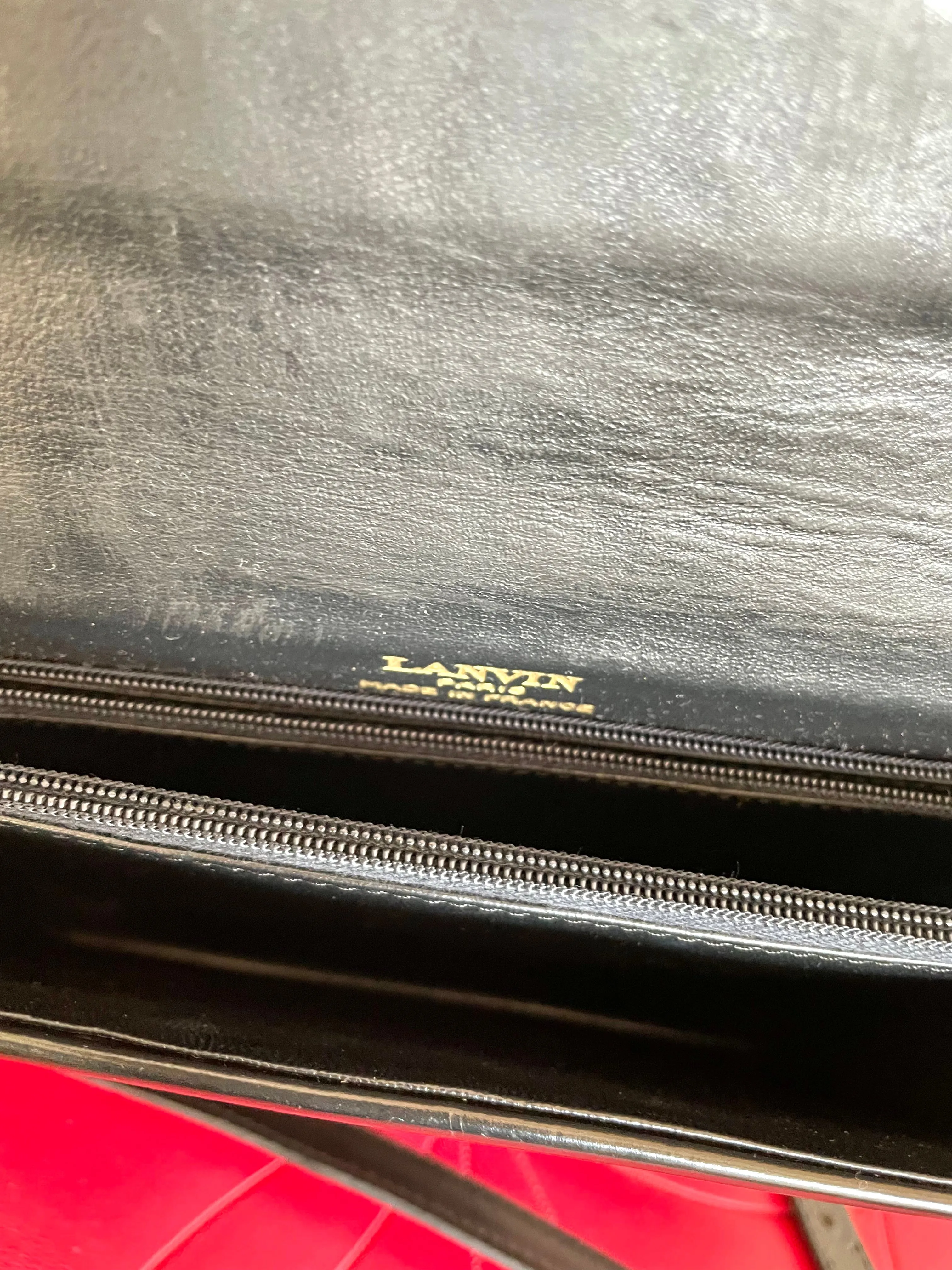 Vintage Lanvin black leather shoulder bag with iconic golden logo motif, Classic purse for daily use. 050222ya1