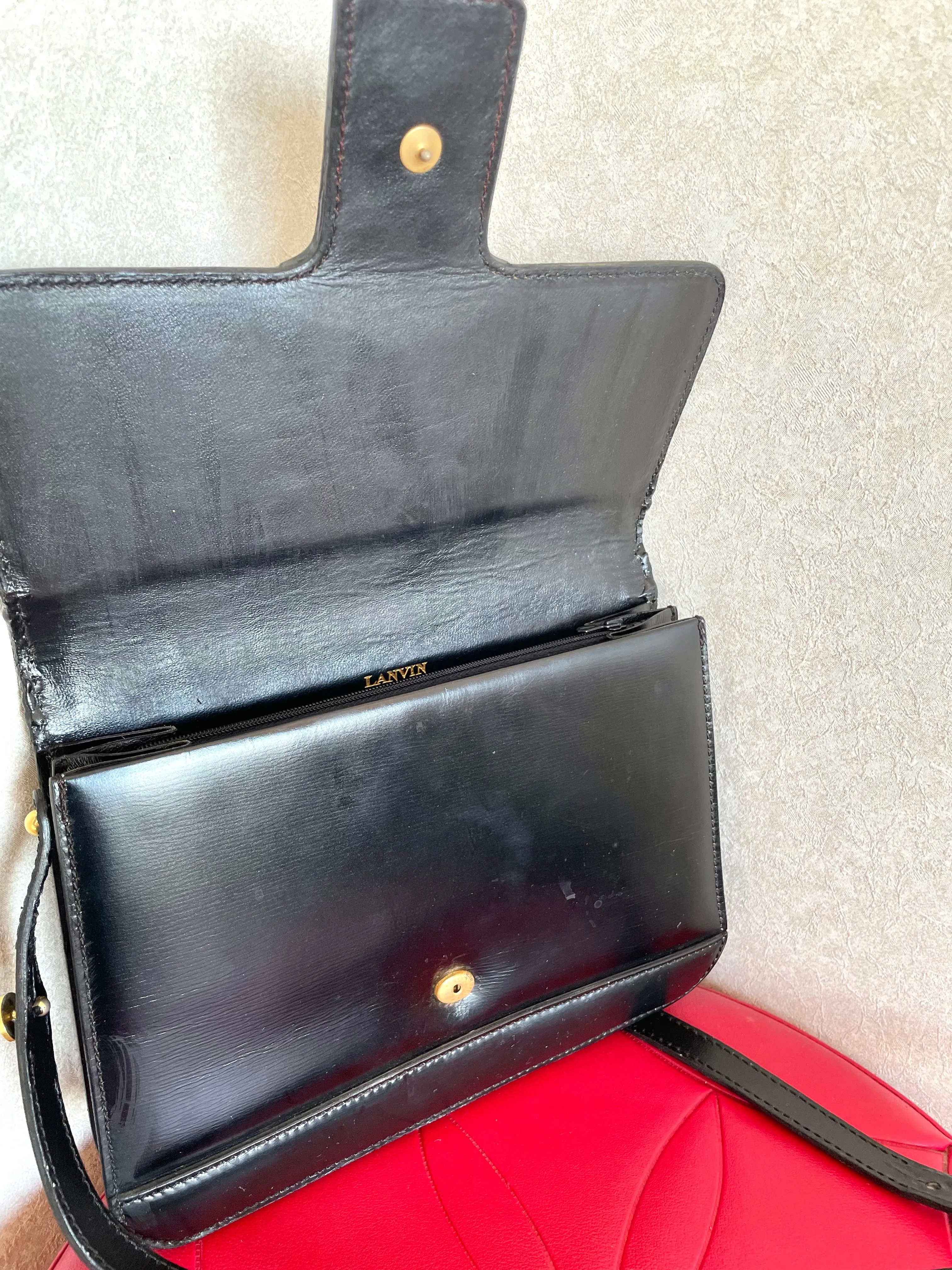Vintage Lanvin black leather shoulder bag with iconic golden logo motif, Classic purse for daily use. 050222ya1
