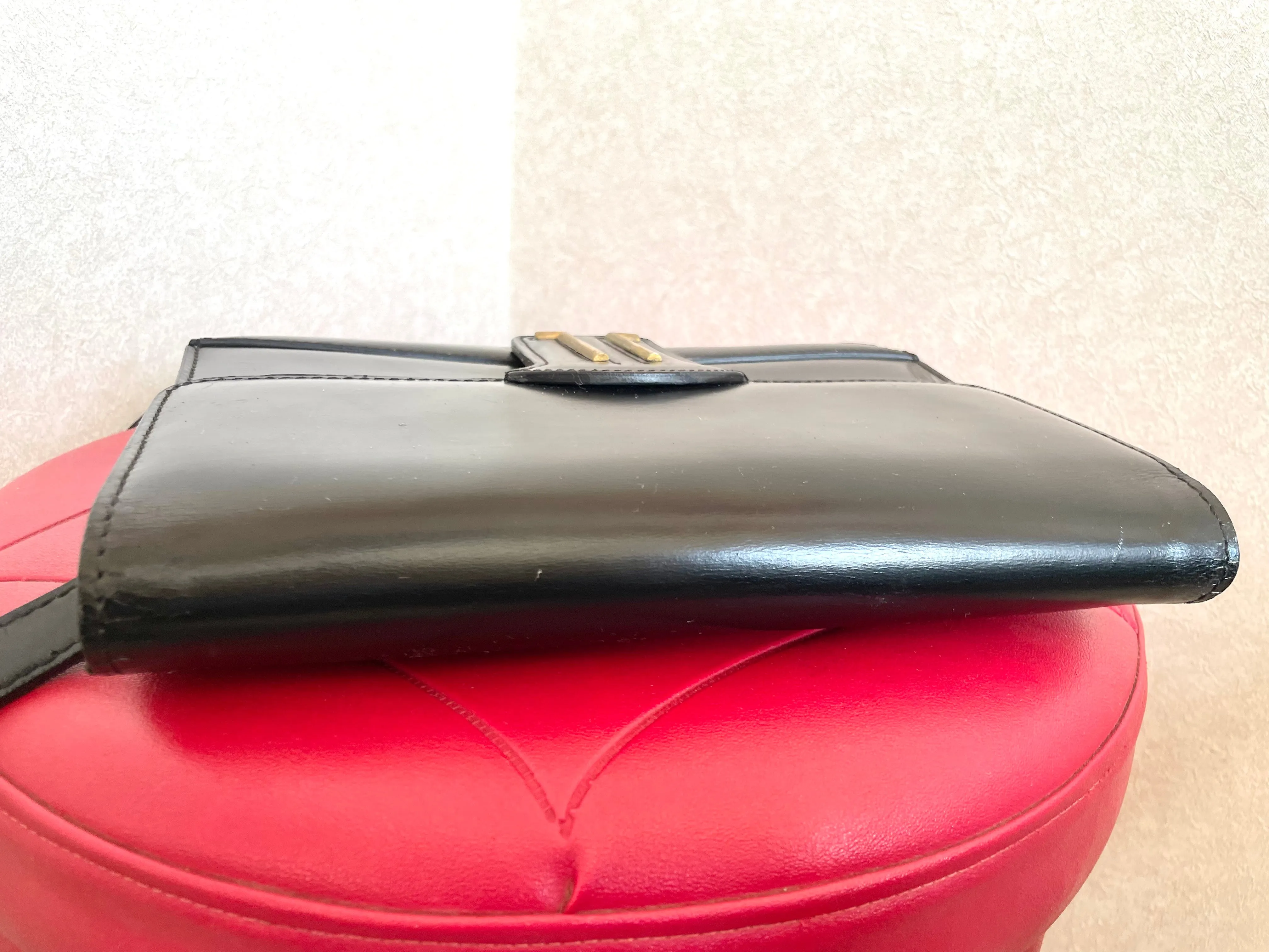 Vintage Lanvin black leather shoulder bag with iconic golden logo motif, Classic purse for daily use. 050222ya1