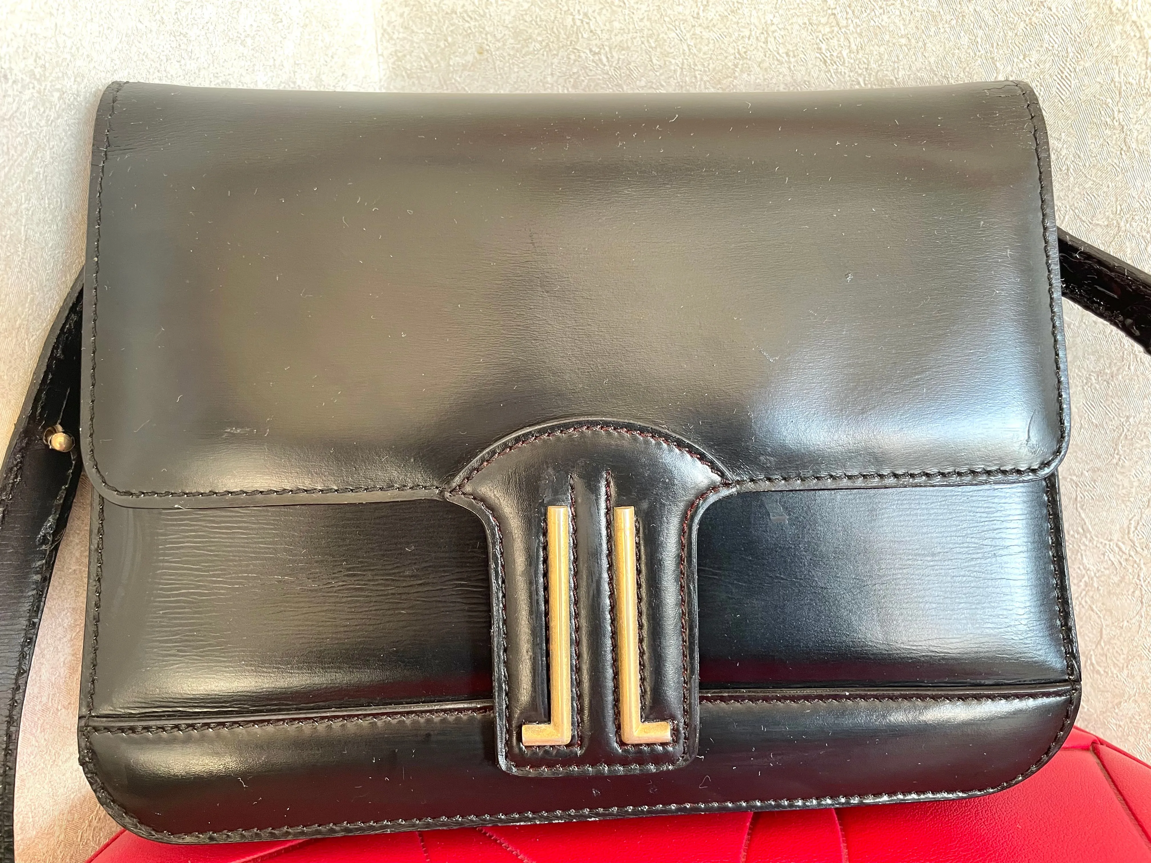 Vintage Lanvin black leather shoulder bag with iconic golden logo motif, Classic purse for daily use. 050222ya1